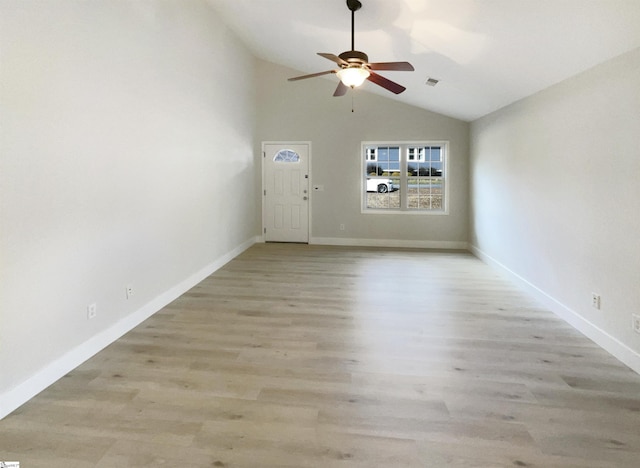 unfurnished living room with ceiling fan, vaulted ceiling, and light hardwood / wood-style floors