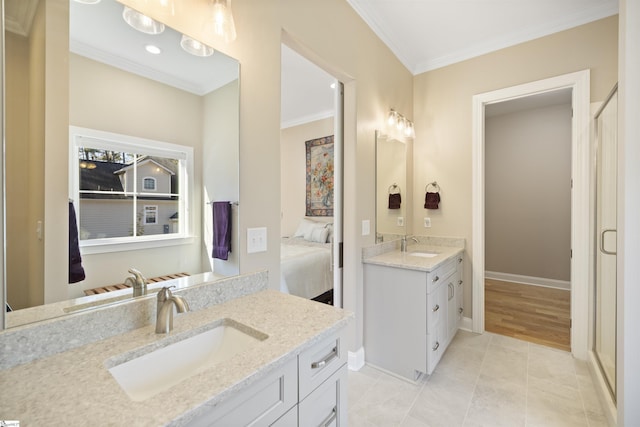 bathroom featuring ornamental molding, vanity, and tile patterned flooring