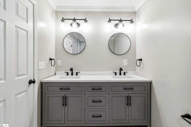 bathroom with crown molding and vanity