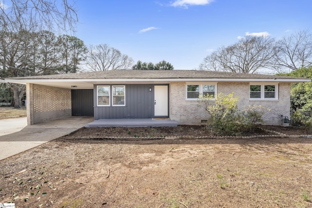 single story home featuring a carport