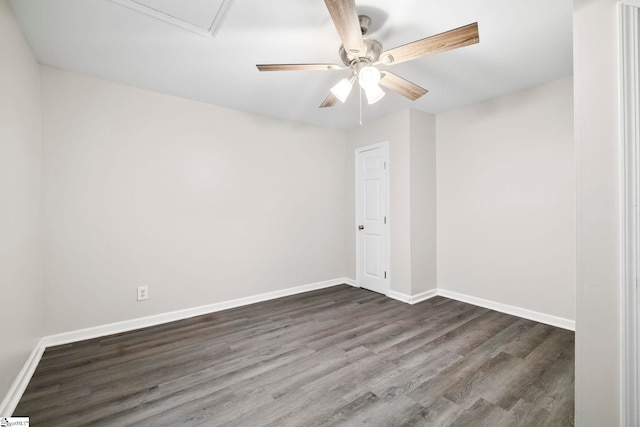 empty room with ceiling fan and dark wood-type flooring