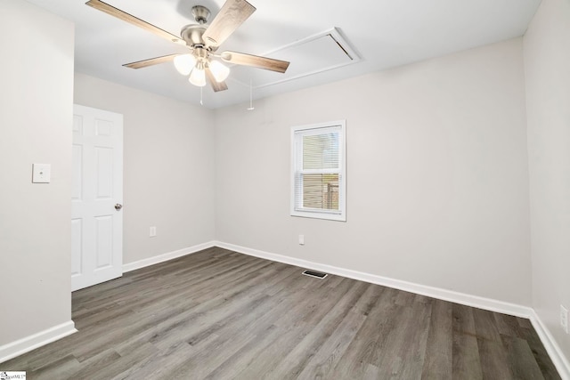 empty room with ceiling fan and wood-type flooring