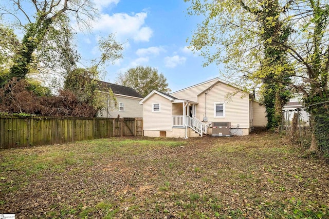 back of property featuring cooling unit