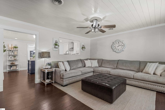 living room with ornamental molding, dark wood-type flooring, and ceiling fan