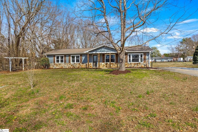 ranch-style house with a front lawn