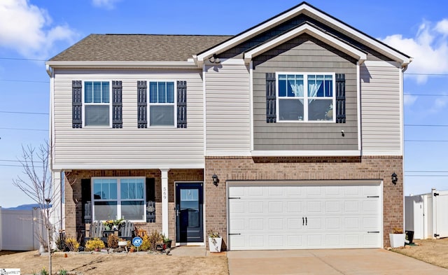 view of front of property featuring a garage, driveway, brick siding, and covered porch