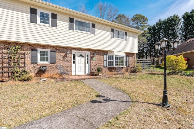 view of front of home with a front lawn