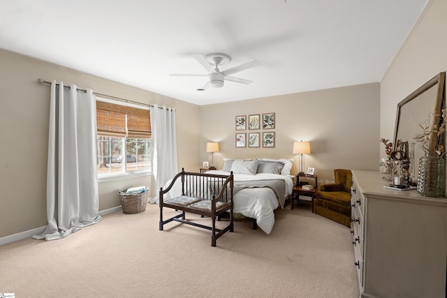 bedroom with ceiling fan, light carpet, and crown molding