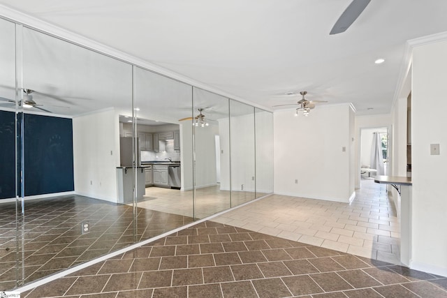 unfurnished living room with ornamental molding, dark tile patterned flooring, ceiling fan, and recessed lighting