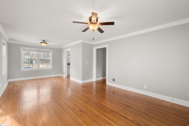 unfurnished room with baseboards, ceiling fan, ornamental molding, and light wood-style floors