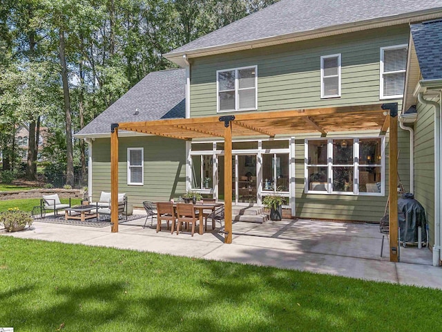 back of house featuring an outdoor fire pit, a patio area, a lawn, a pergola, and roof with shingles