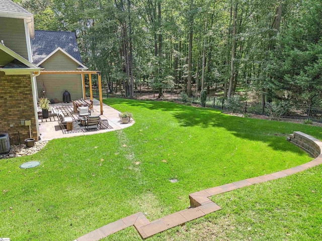 view of yard featuring fence and a patio area