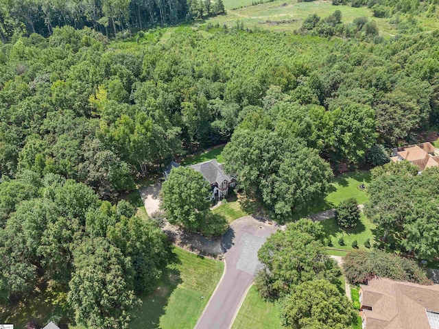 drone / aerial view with a view of trees