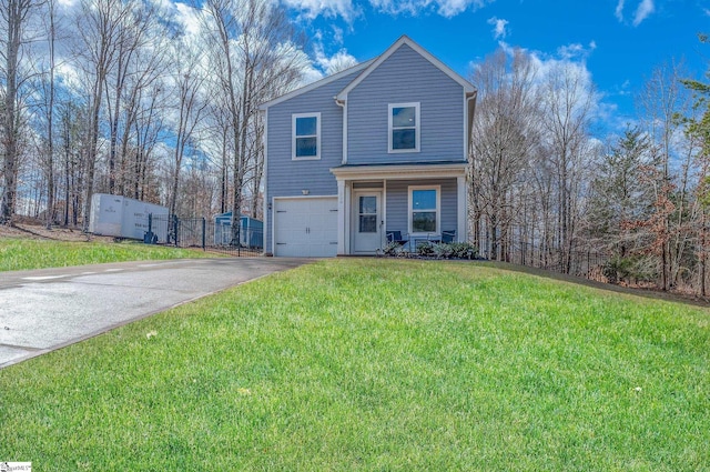 traditional home featuring a garage, fence, aphalt driveway, and a front lawn