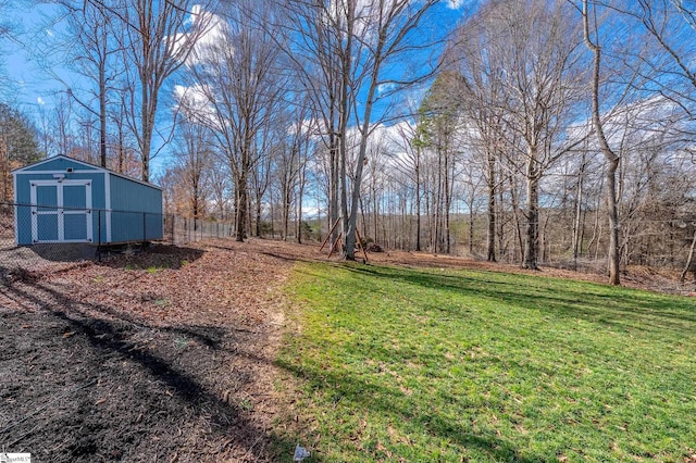 view of yard featuring an outbuilding and a storage shed