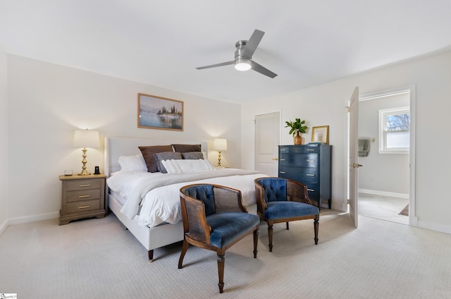 bedroom with baseboards, a ceiling fan, and light colored carpet