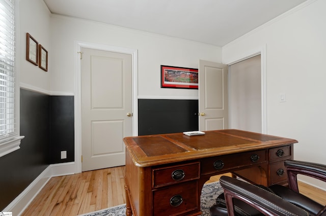 home office with baseboards, light wood-style flooring, and crown molding