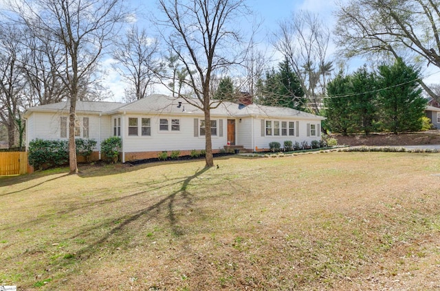 ranch-style house with a front yard and crawl space