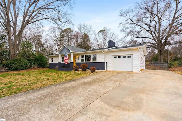 ranch-style home featuring concrete driveway, a chimney, an attached garage, fence, and a front yard