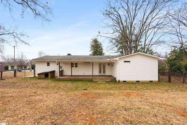 back of house with a yard, a gate, fence, and a wooden deck