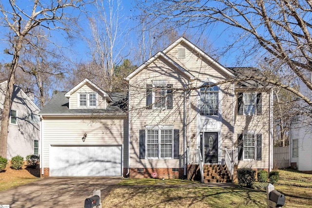 view of front facade with a garage, a front yard, driveway, and crawl space