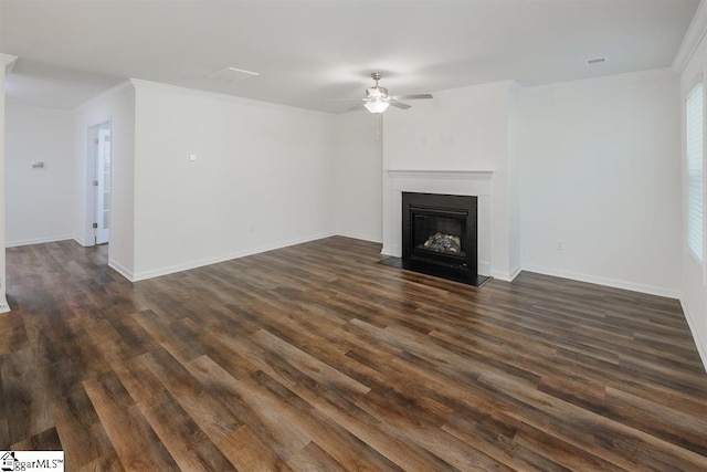 unfurnished living room featuring baseboards, a ceiling fan, a fireplace with flush hearth, ornamental molding, and dark wood-type flooring