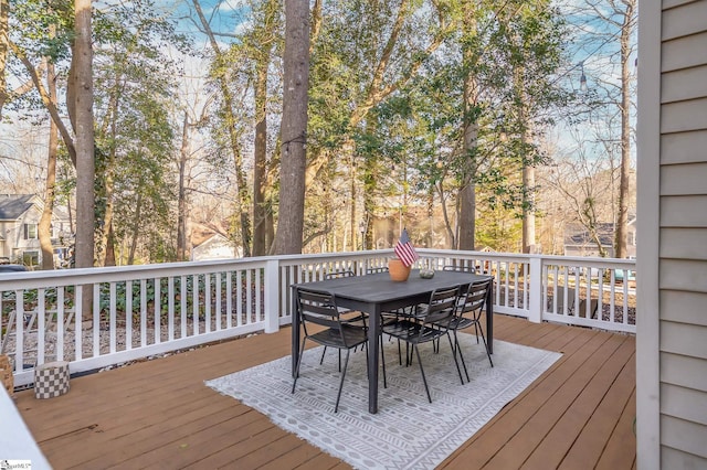 wooden terrace with outdoor dining area