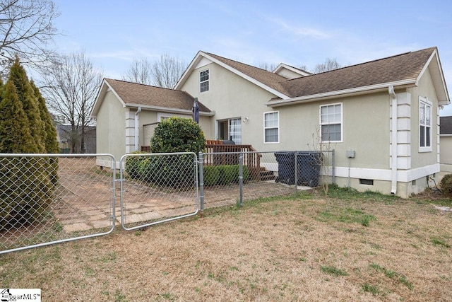 back of property featuring fence private yard, a yard, roof with shingles, crawl space, and a gate