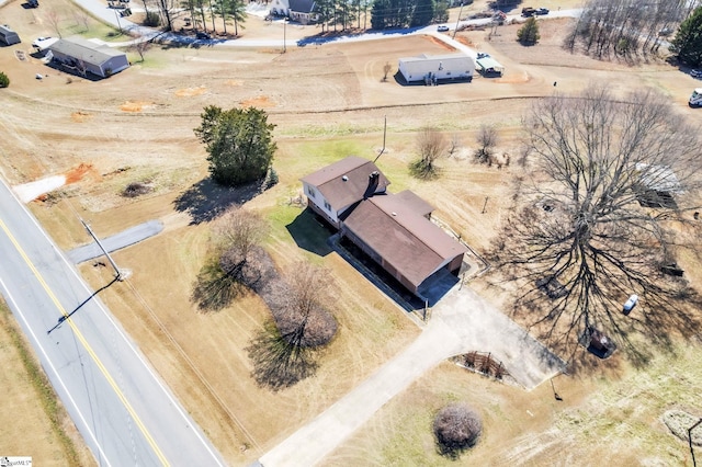 birds eye view of property featuring a rural view