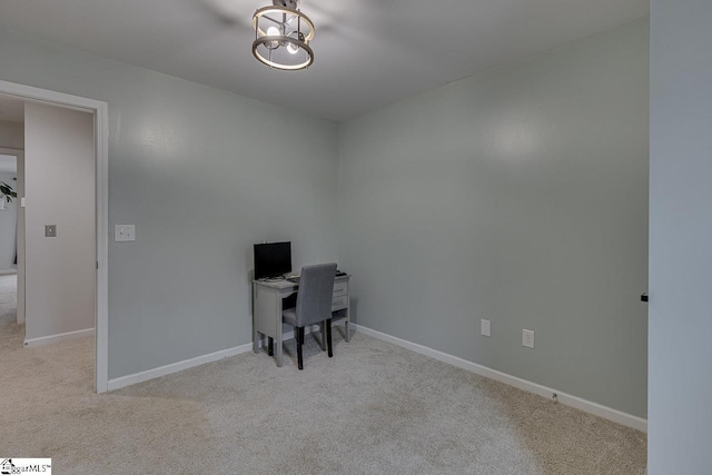 office area with light carpet and baseboards