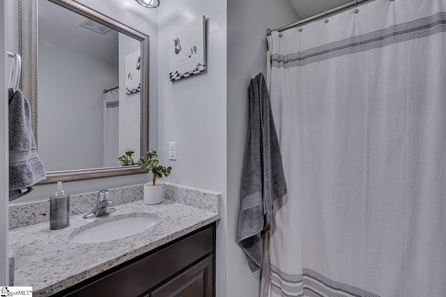 bathroom featuring visible vents and vanity