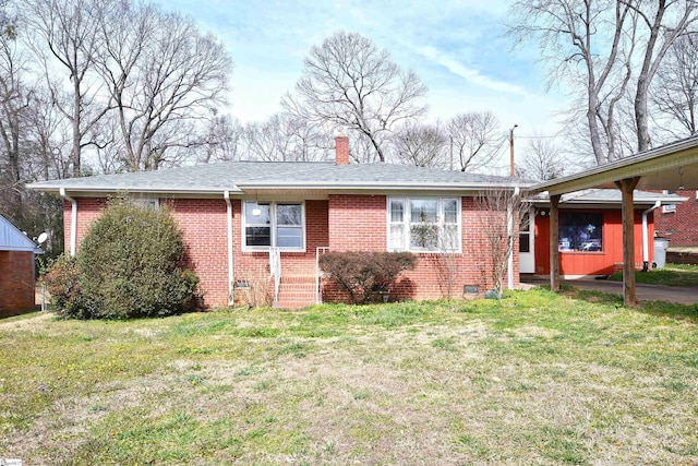 ranch-style house with brick siding, crawl space, and a front yard