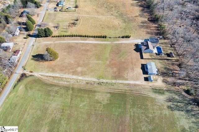 birds eye view of property with a rural view