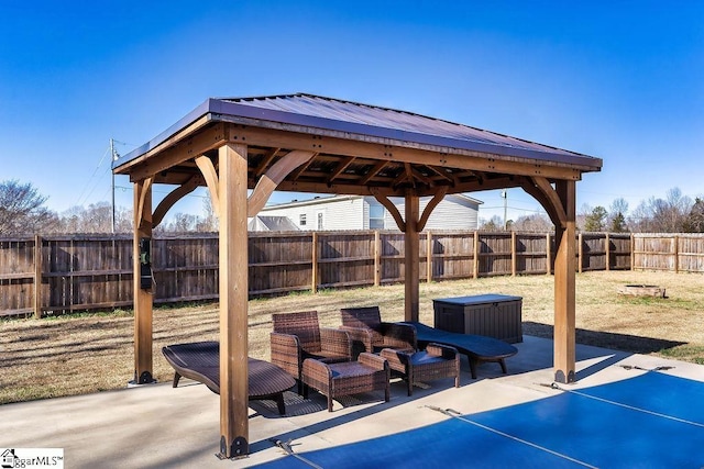 view of patio with a fenced backyard and a gazebo