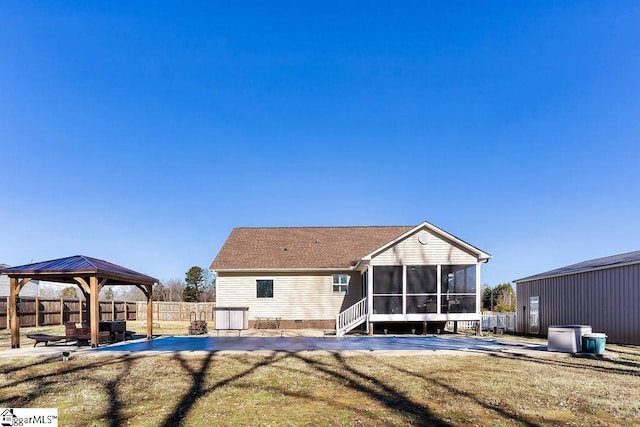 back of house with a patio, fence, a sunroom, a gazebo, and crawl space