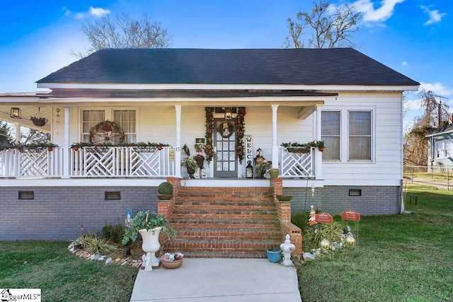 view of front of house featuring a porch, crawl space, and roof with shingles