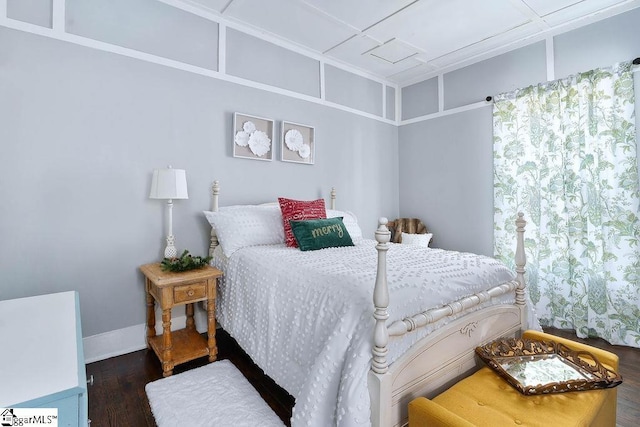 bedroom featuring dark wood-type flooring and baseboards