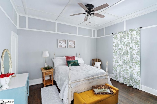 bedroom featuring ceiling fan, dark wood-type flooring, and baseboards