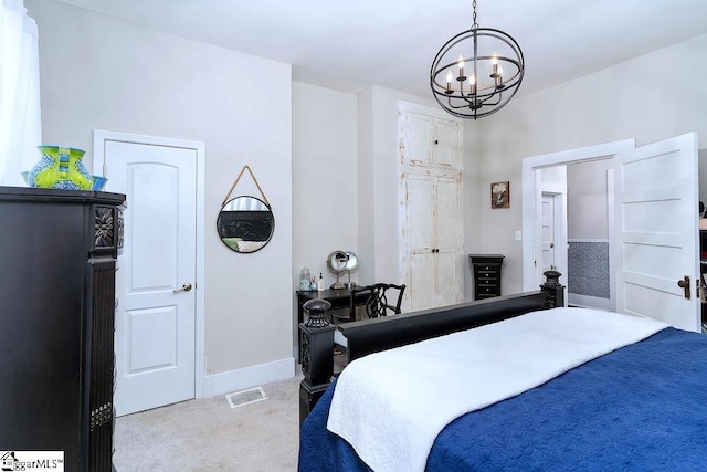 bedroom featuring light carpet, a notable chandelier, visible vents, and baseboards