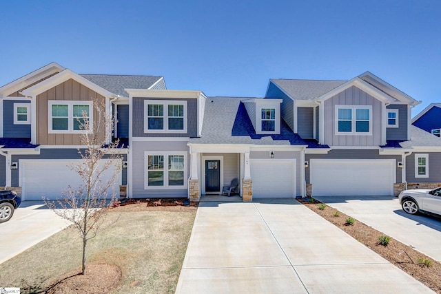 view of front of property featuring a garage, board and batten siding, and concrete driveway