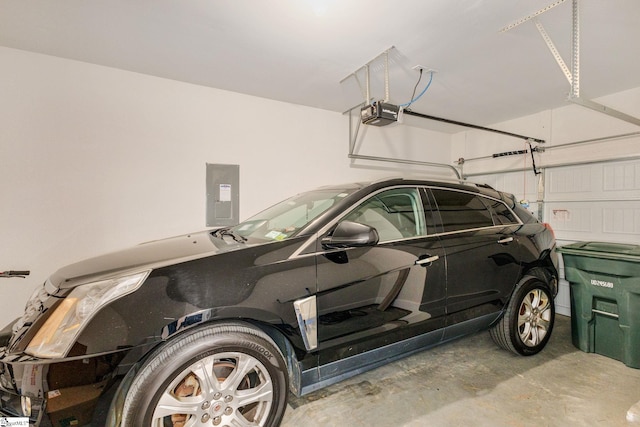 garage with electric panel and a garage door opener