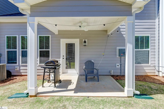 view of patio / terrace featuring central AC unit, a ceiling fan, and area for grilling