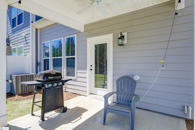 view of patio / terrace with central air condition unit, fence, grilling area, and a ceiling fan