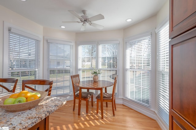 dining room featuring light wood-style floors, recessed lighting, a healthy amount of sunlight, and ceiling fan