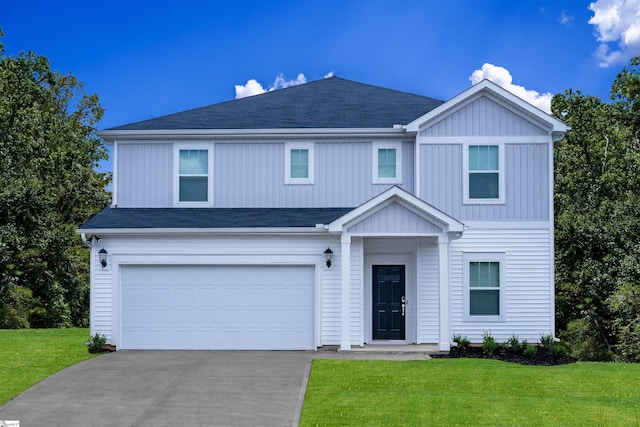 view of front of house with board and batten siding, an attached garage, a front lawn, and concrete driveway