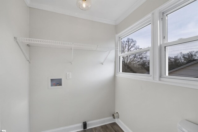 clothes washing area featuring hookup for a washing machine, laundry area, baseboards, ornamental molding, and dark wood-style floors