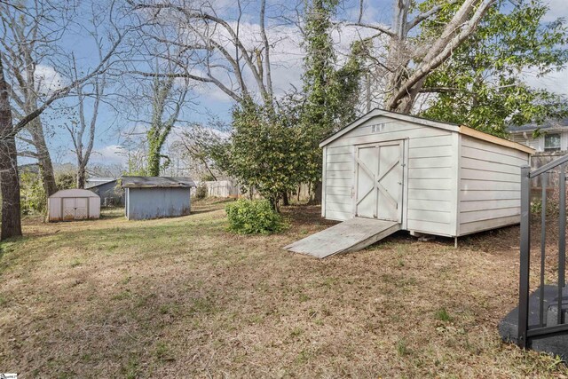 view of shed with fence