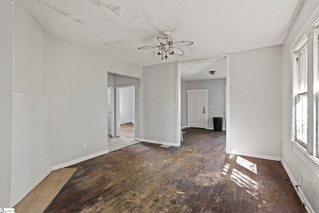 unfurnished room featuring dark wood finished floors and baseboards