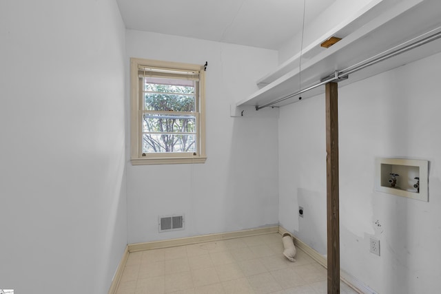 clothes washing area featuring washer hookup, light floors, visible vents, hookup for an electric dryer, and laundry area