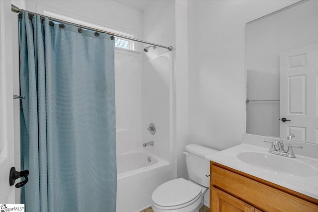 bathroom featuring shower / bath combo, vanity, and toilet